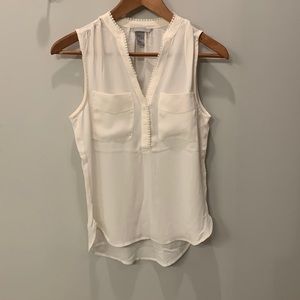 Cream tank too blouse with delicate detail around chest. Size 2